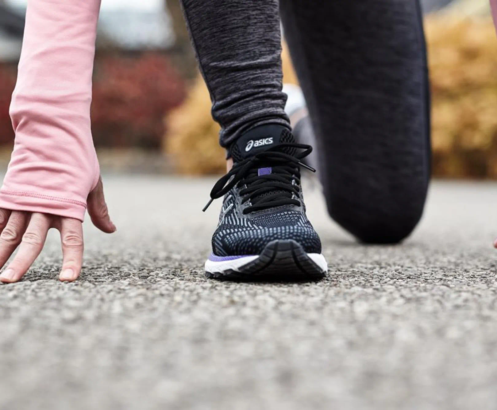 person in athletic clothes set to run