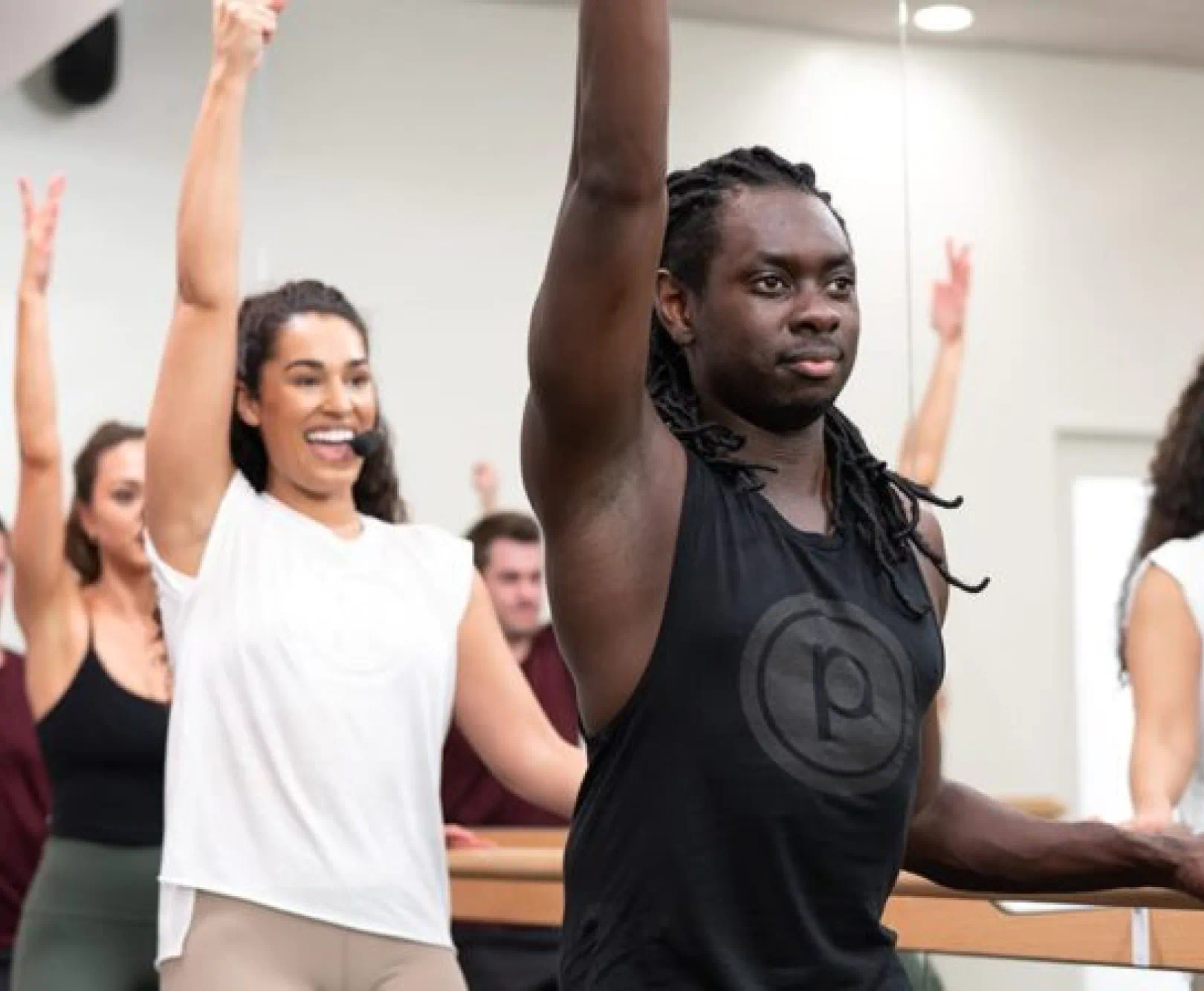 person at bar in fitness class
