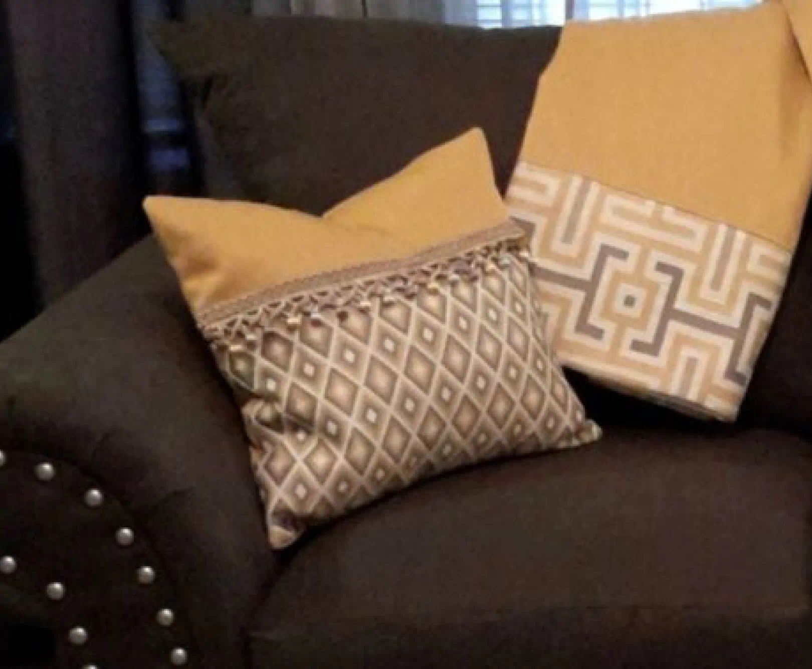 pillow and blanket staged on couch