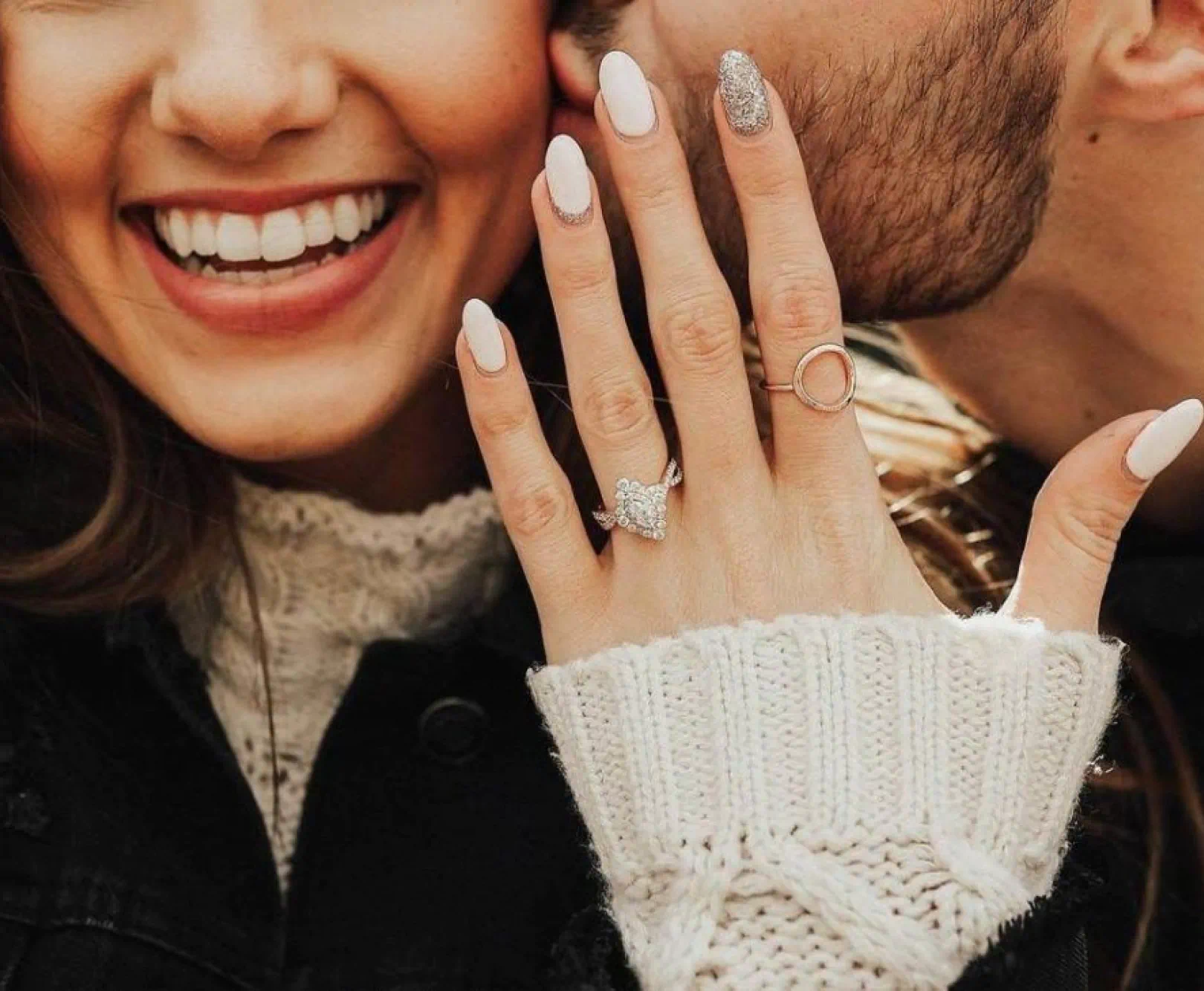 person showing hand with engagement ring